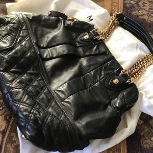 Marc Jacob large black quilted and pleated Italian handbag with gold chain.